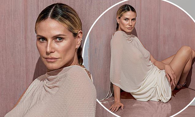 Heidi Klum, 49, goes braless in a sheer cream top as she poses for