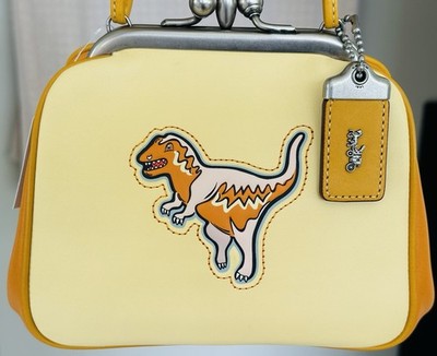 NWT COACH 1941 PALE YELLOW REXY KISSLOCK FRAME SATCHEL NICKEL