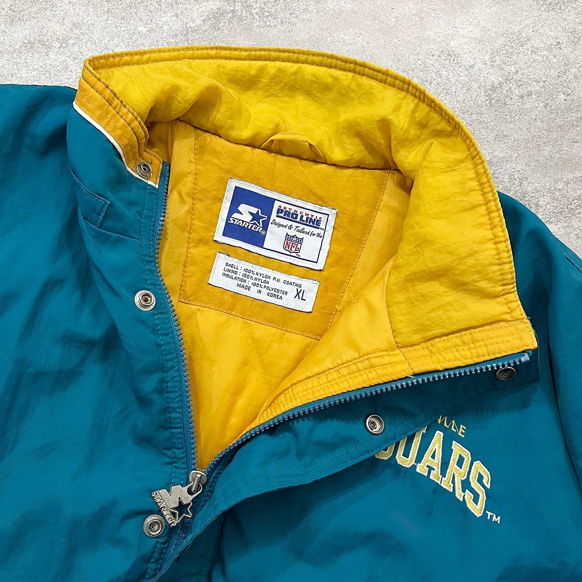 VTG 90s NFL JACKSONVILLE JAGUARS LOGO STARTER PUFFER JACKET SIZE