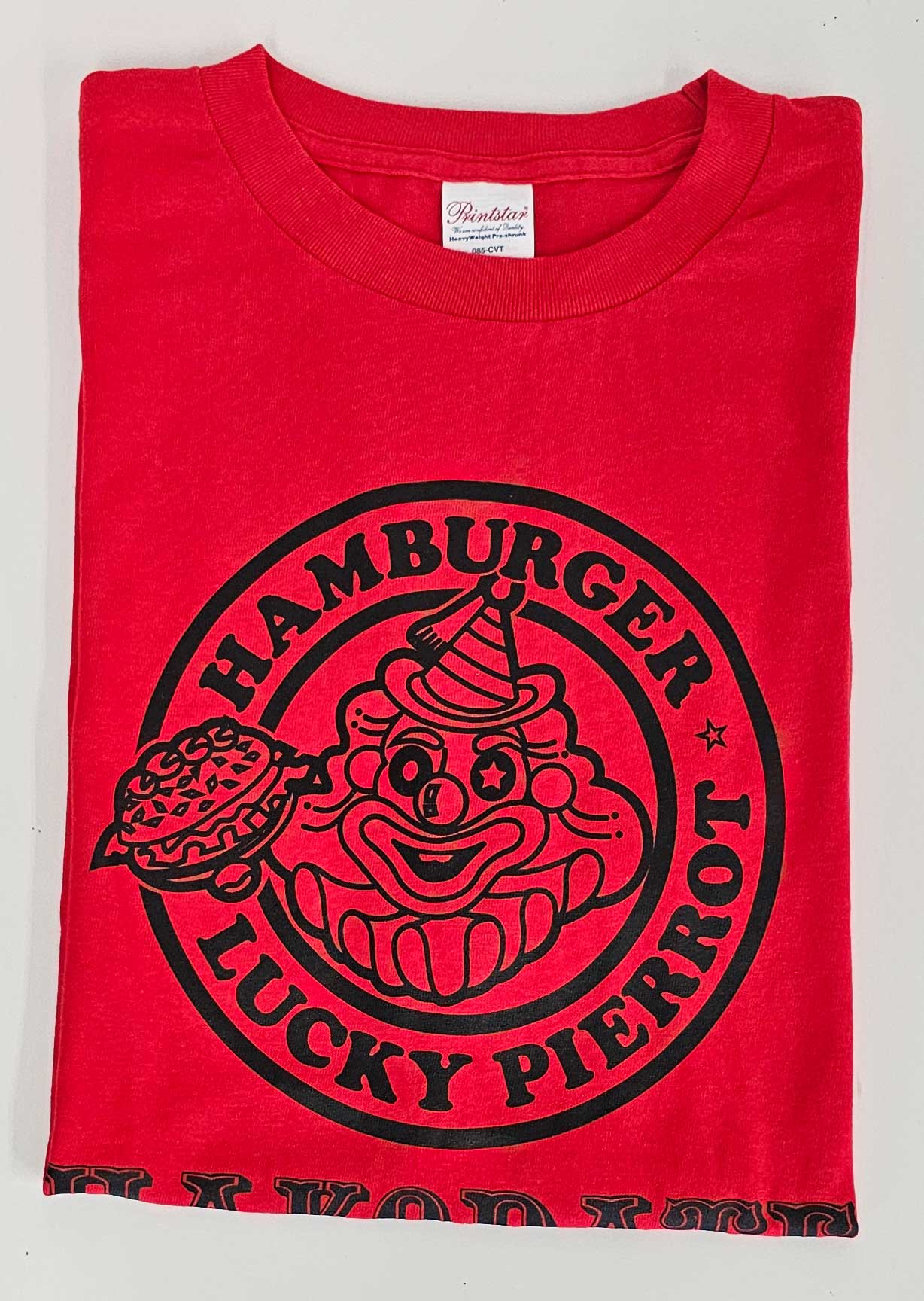 新作Tシャツ 紫（ロゴ緑）・赤（ロゴ黒） - 函館ラッキーピエロ