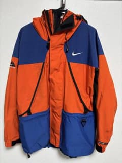 Nike ACG マウンテンパーカー オレンジ/ブルー - メルカリ