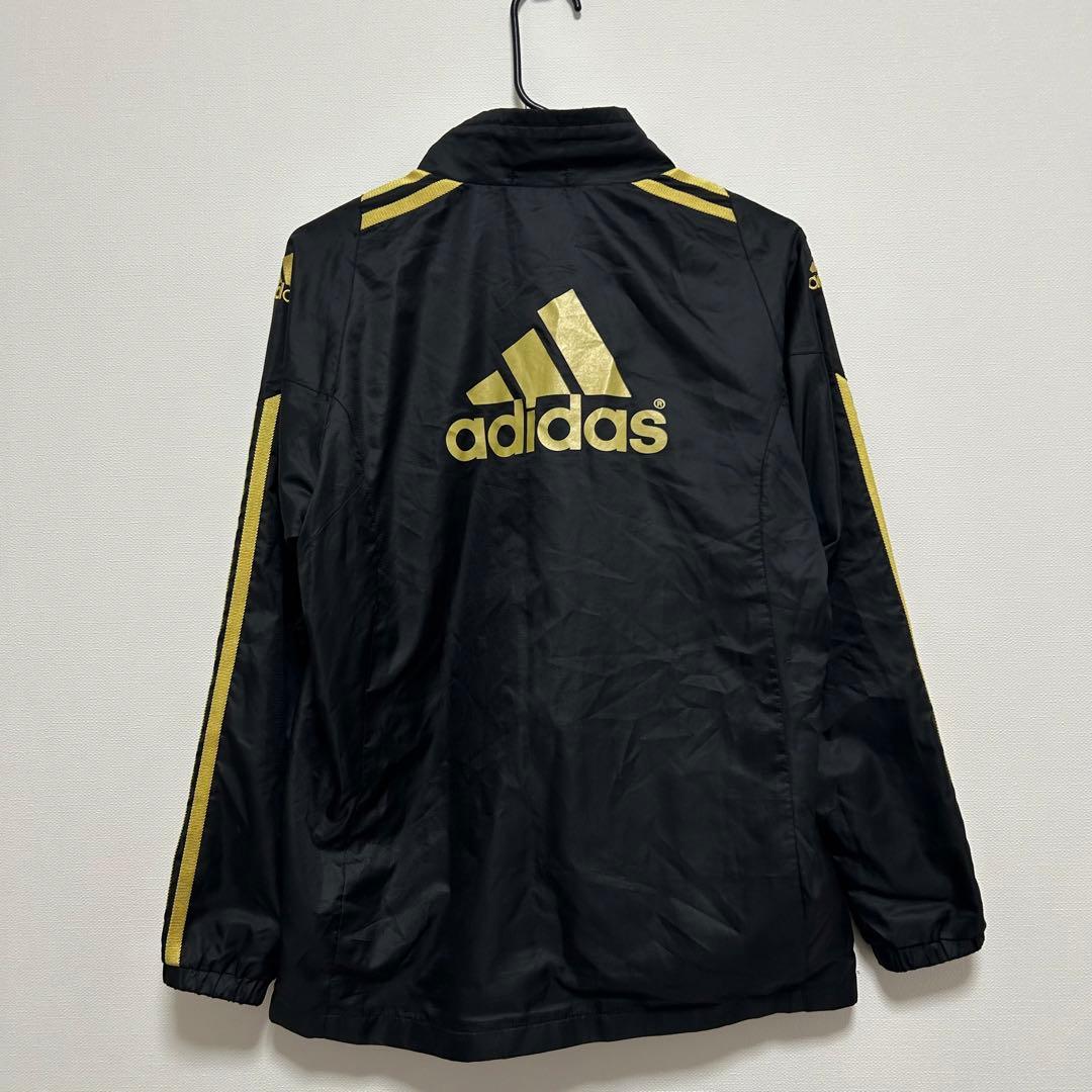 アディダス ウインドジャケット 150 黒 ゴールド ウインドブレーカー