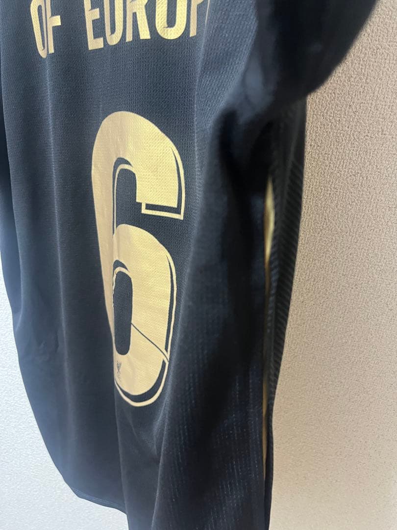 リバプールFC 18/19UCL優勝記念ユニフォーム 黒×金 L-XLサイズ - メルカリ