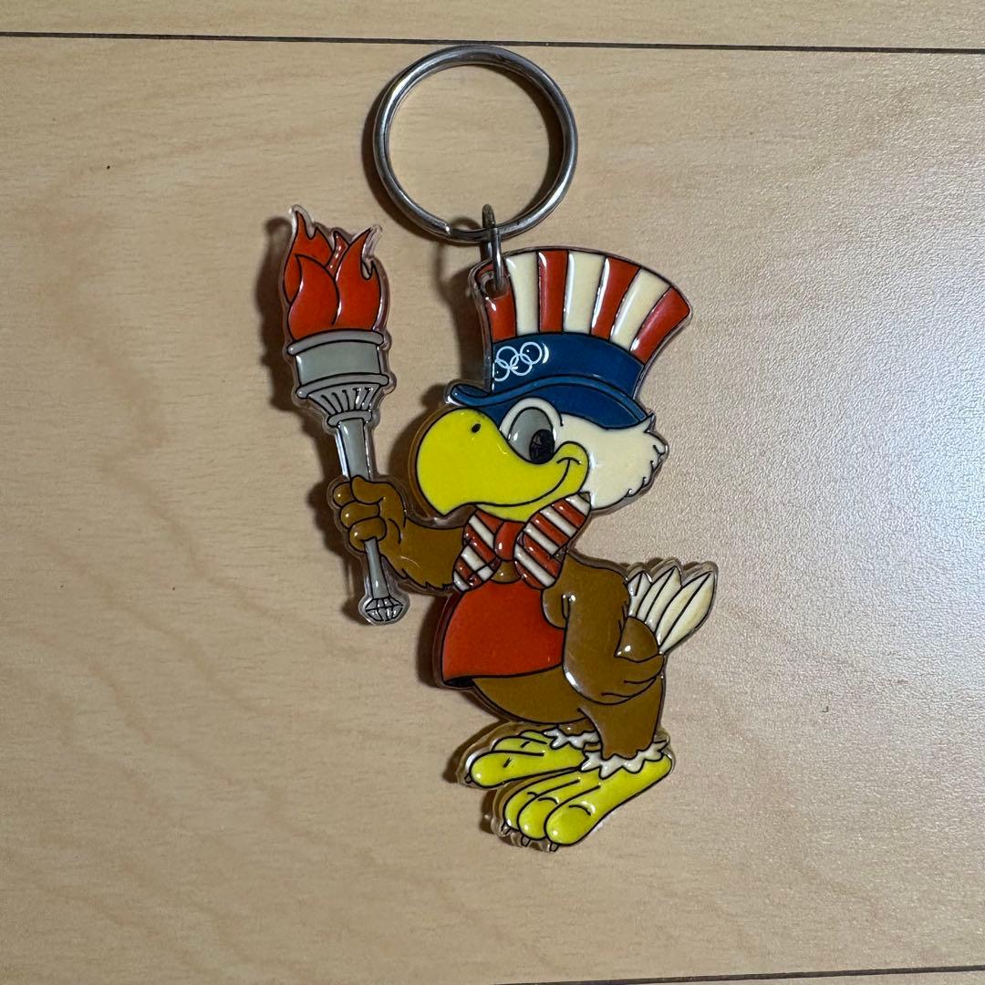 希少80s ロサンゼルスオリンピックキーホルダー、イーグルサム - メルカリ