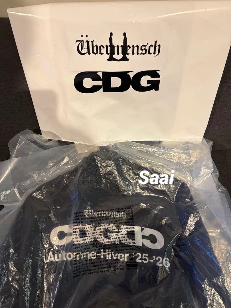 CDG x G-DRAGON Übermensch STAFF COAT ERA-DEFINING: CDG has unveiled a capsule collection created with G